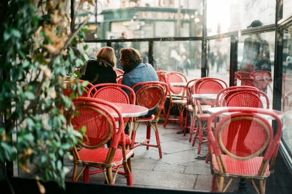 visit little cafes in Paris as a part of your Paris travel itinerary