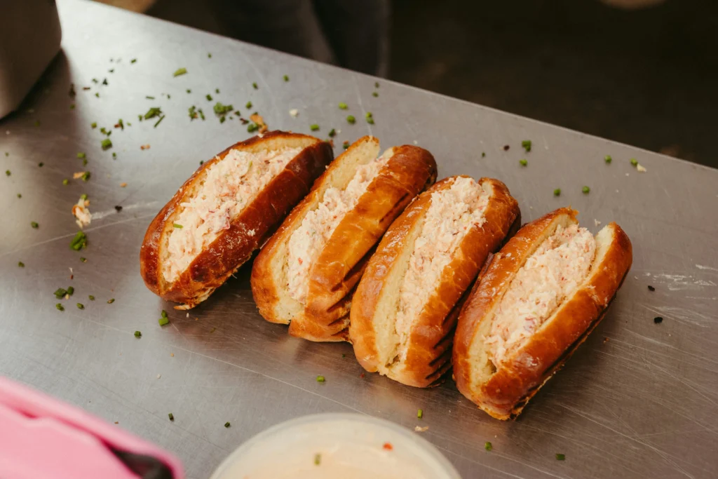 Fresh Maine lobster roll on a toasted bun, must-try American foods to try