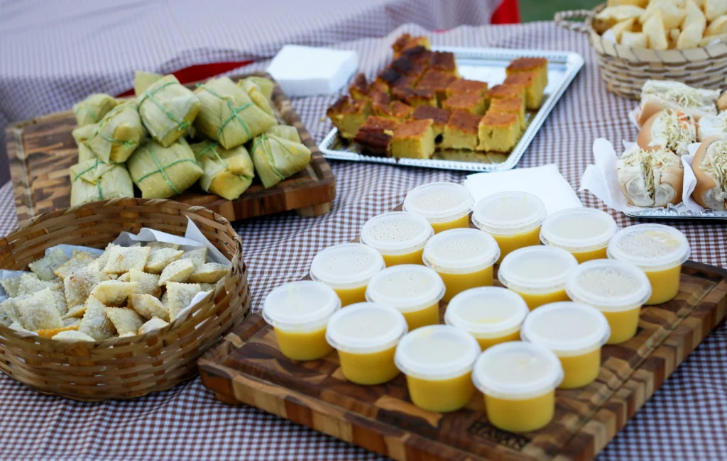 Traditional Día de los Muertos foods in Mexico including pan de muerto sweet bread and atole, served as offerings for the departed.