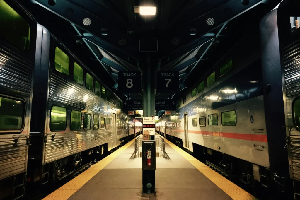 Traveler boarding train instead of plane – sustainable travel tips for a more eco friendly vacation